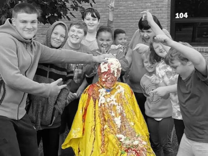 Kids outside a school conducting science experiment